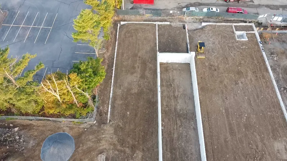 Bulldozer smoothing out foundation for concrete pouring